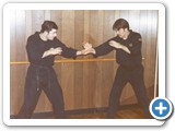 Quote: Here's Carl and I in our first self-defense school in Linden, NJ circa 1979. Notice the early defiance of traditional arts by wearing black GI, T-shirts, and wrestling shoes. The name of our school was Personal Survival Tactics (Carl's idea).